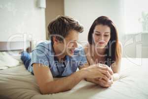 Romantic couple relaxing on bed