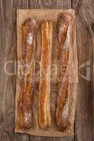 Baguettes on wooden background