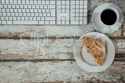 Keyboard, coffee cup and cookies