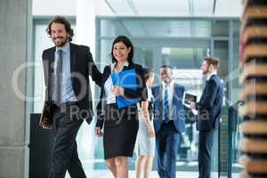 Businesswoman walking with colleague