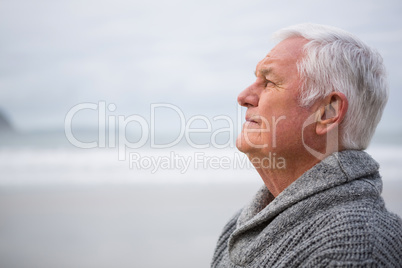 Thoughtful senior man standing