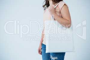 Beautiful woman carrying shopping bag