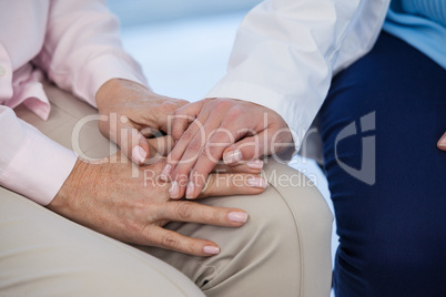 Close-up of female doctor consoling a patient