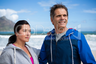 Couple looking away while standing