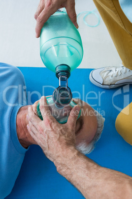 Paramedic performing resuscitation on patient