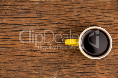 Cup of coffee on wooden table