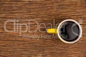 Cup of coffee on wooden table