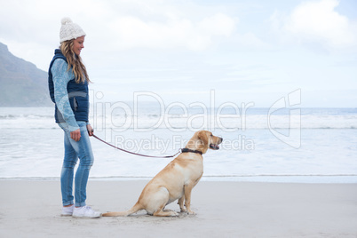 Woman standing with pet dog