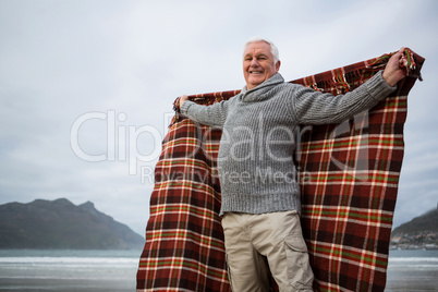 Senior man enjoying on beach