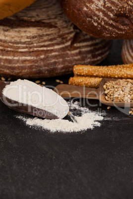 Various bread loaves with flour