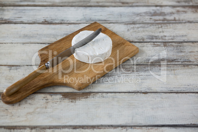 Slice of cheese with knife