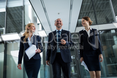 Businesspeople walking in the office