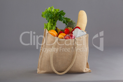 Vegetables and fruits in grocery bag