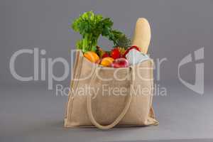 Vegetables and fruits in grocery bag