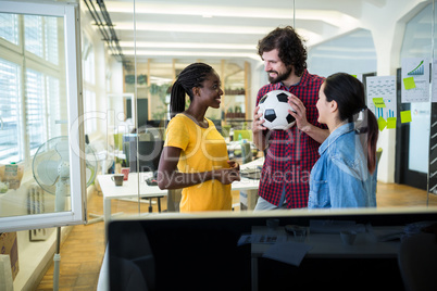 Team of business executives interacting with each other