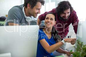 Team of graphic designers working at desk