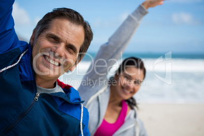 Couple performing stretching exercise