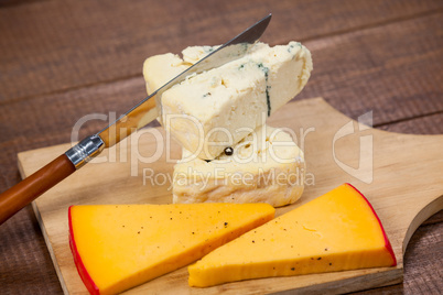 Slices of cheese with knife