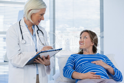 Pregnant patient consulting a doctor