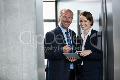 Businessman with colleague in an elevator