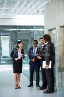 Businesswoman talking with colleagues