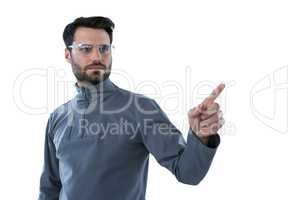 Man wearing protective eyewear pretending to touch an invisible object