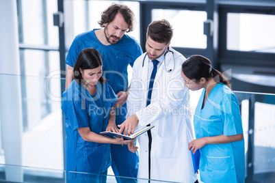 Surgeons, doctor and nurse having a discussion