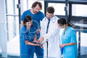 Surgeons, doctor and nurse having a discussion