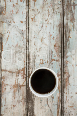 Cup of coffee on wooden table