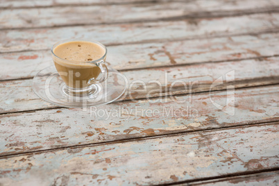 Cup of coffee on wooden table