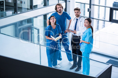 Surgeons, doctor and nurse standing in hospital