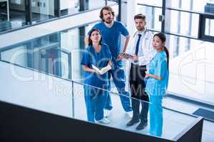 Surgeons, doctor and nurse standing in hospital