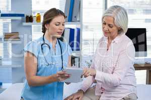 Doctor showing prescription to patient
