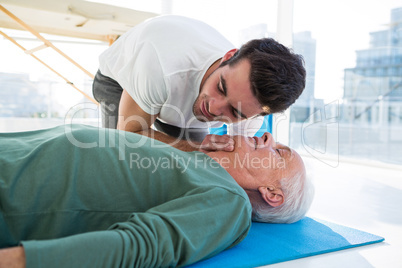 Paramedic performing resuscitation on patient