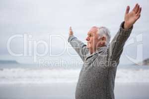Senior man exercising on beach