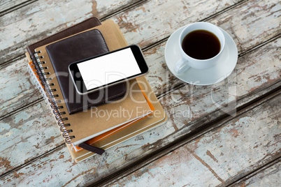 Organiser with mobile phone and coffee