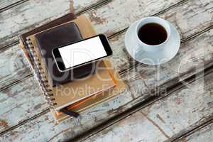 Organiser with mobile phone and coffee