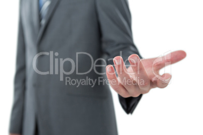 Businessman gesturing against white background