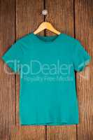 Turquoise t-shirt on hanger