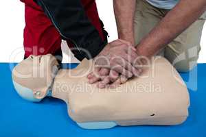 Paramedic training cardiopulmonary resuscitation to man