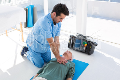 Doctor performing resuscitation on patient