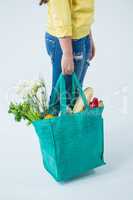 Woman carrying grocery bag
