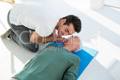 Paramedic performing resuscitation on patient