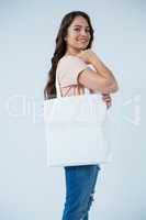 Beautiful woman carrying shopping bag