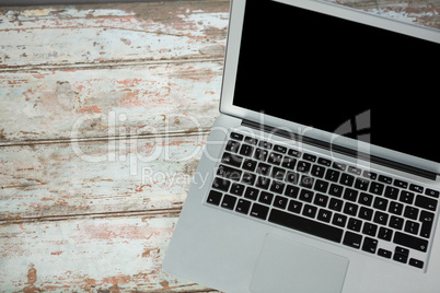 Laptop on wooden table