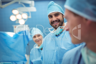 Portrait of male surgeon standing in operation theater