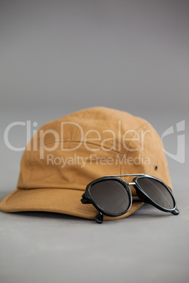 Brown cap with sunglasses