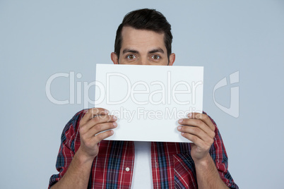 Man holding a blank placard