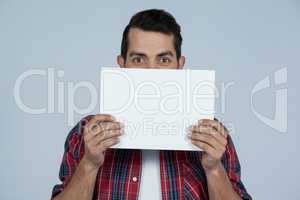 Man holding a blank placard