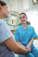 Nurse consoling female patient
